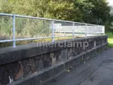 Mesh panel handrail system fitted at railway station for pedestrian barrier