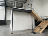 Interclamp galvanised key clamp handrail installed on a mezzanine floor & stairs