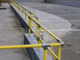 DDA disability handrail system fitted infant of parking spaces by a cafe in Wales