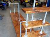 Industrial wooden clothing rail and shelves using Interclamp clothing rail from steel tube and key clamp fittings 