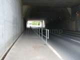 pathway with handrail system fitted in road tunnel