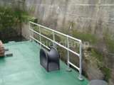 Steel safety barrier and handrails fitted by concrete wall 