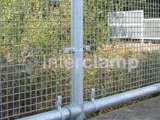 Mesh handrail system fitted at railway station using Interclamp key clamp and tube clamp fittings 