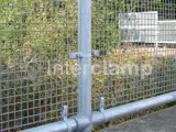 Mesh handrail system fitted at railway station using Interclamp key clamp and tube clamp fittings