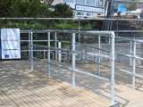 Handrail system fitted on decking in Australia, using steel tube fittings and key clamp fittings