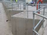 Safety handrails placed on concrete blocks at construction site 
