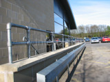 handrail system fitted at a service station in England using Interclamp tube clamp and key clamp fittings 