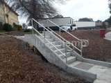 Steel tube handrails for concrete stairs in residential area 
