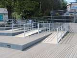 Disability ramp access with decking. Handrails and safety barrier for pedestrians 