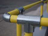 DDA disability handrails outside of cafe. Showing tube clamp fitting on handrails 