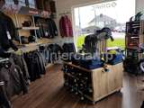 Clothing store stocking jackets and coats. Industrial interior by using Interclamp steel tube and fittings for the clothing rails 